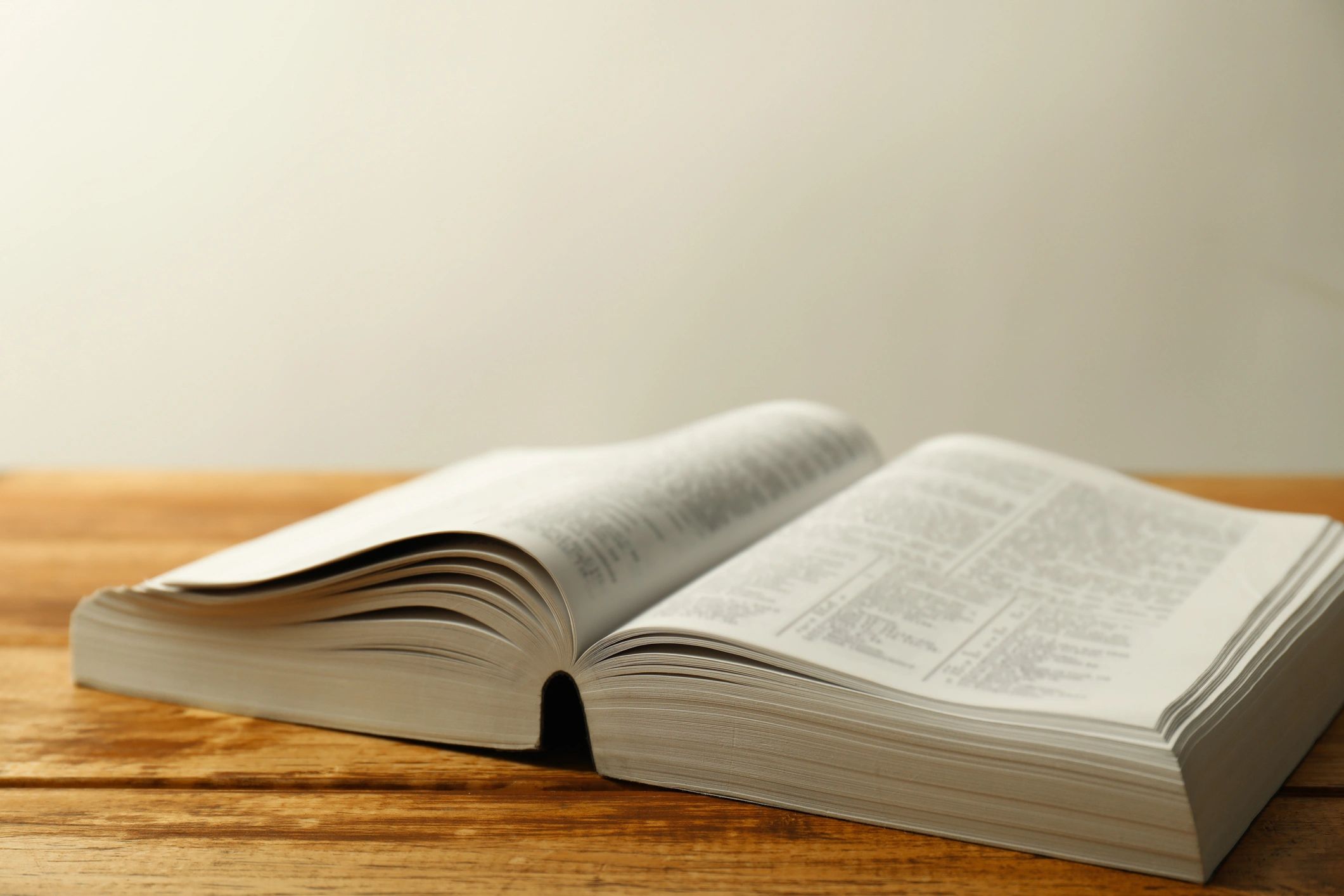 Open Bible on a wooden table